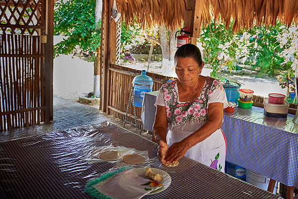 Lady making tortillas