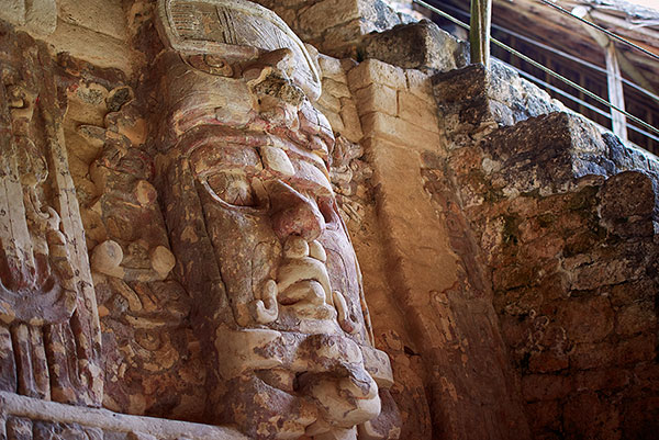 Stucco masks at Kohunlich's temple of the masks.